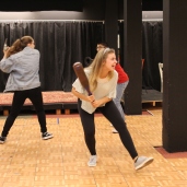 Students practicing their fight scenes